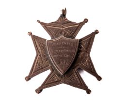 Co. Kilkenny: A rare 9ct gold Maltese Cross design Medal, with central overlay shield inscribed '