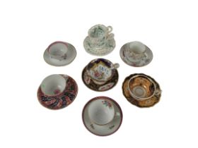 A collection of 8, 19th Century porcelain Cups and Saucers, all hand painted with flowers etc. (8)