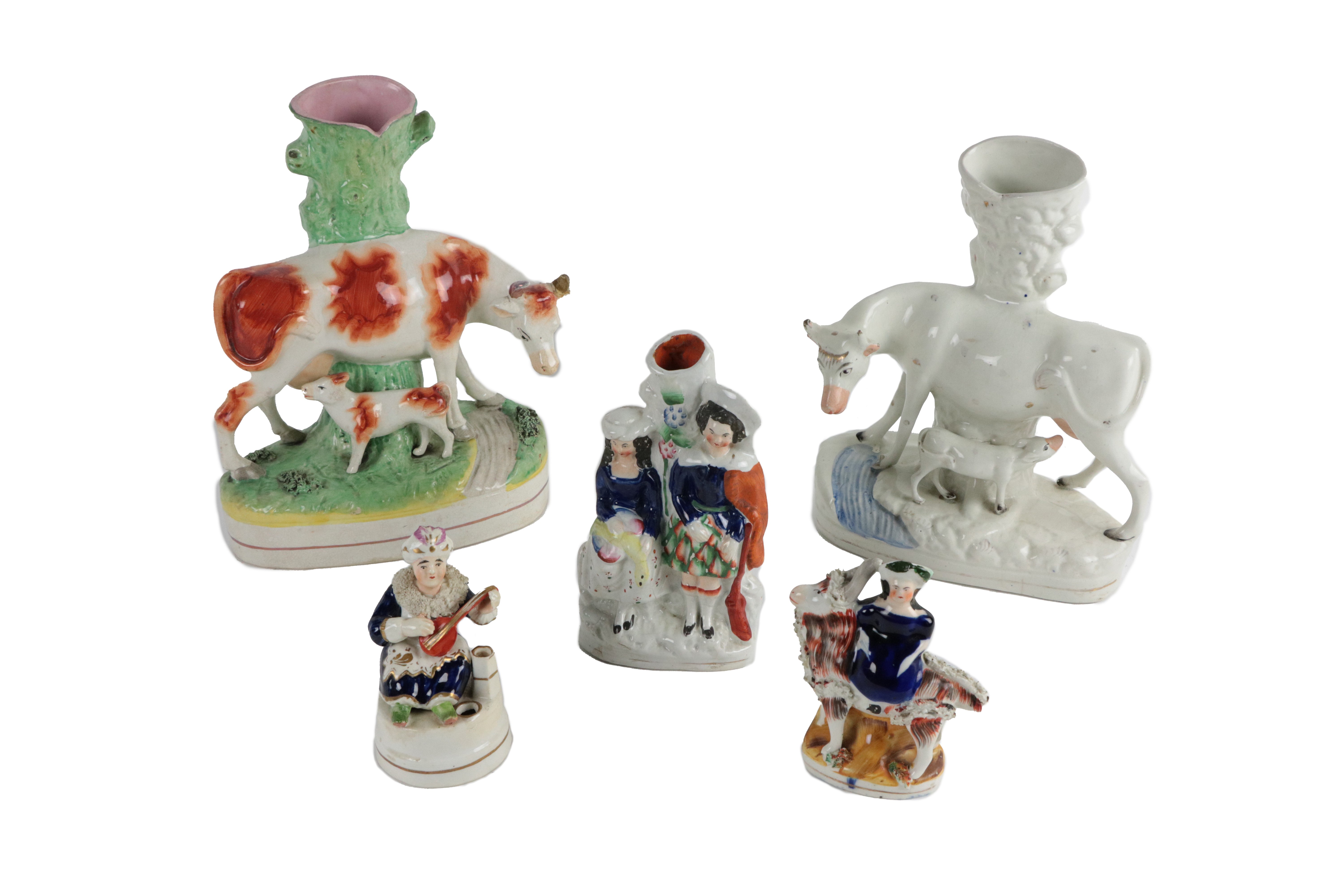 A collection of early Staffordshire porcelain Figures, comprising two large Vases, modelled as cow