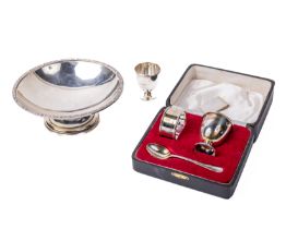 A cased pair of silver Egg Cups, together with Napkin Ring, and associated Spoon [E.V. Viners];