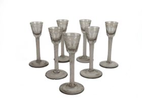 A collection of 7 Irish - 18th Century etched Cordials (Cork), with spiral stems on rounded