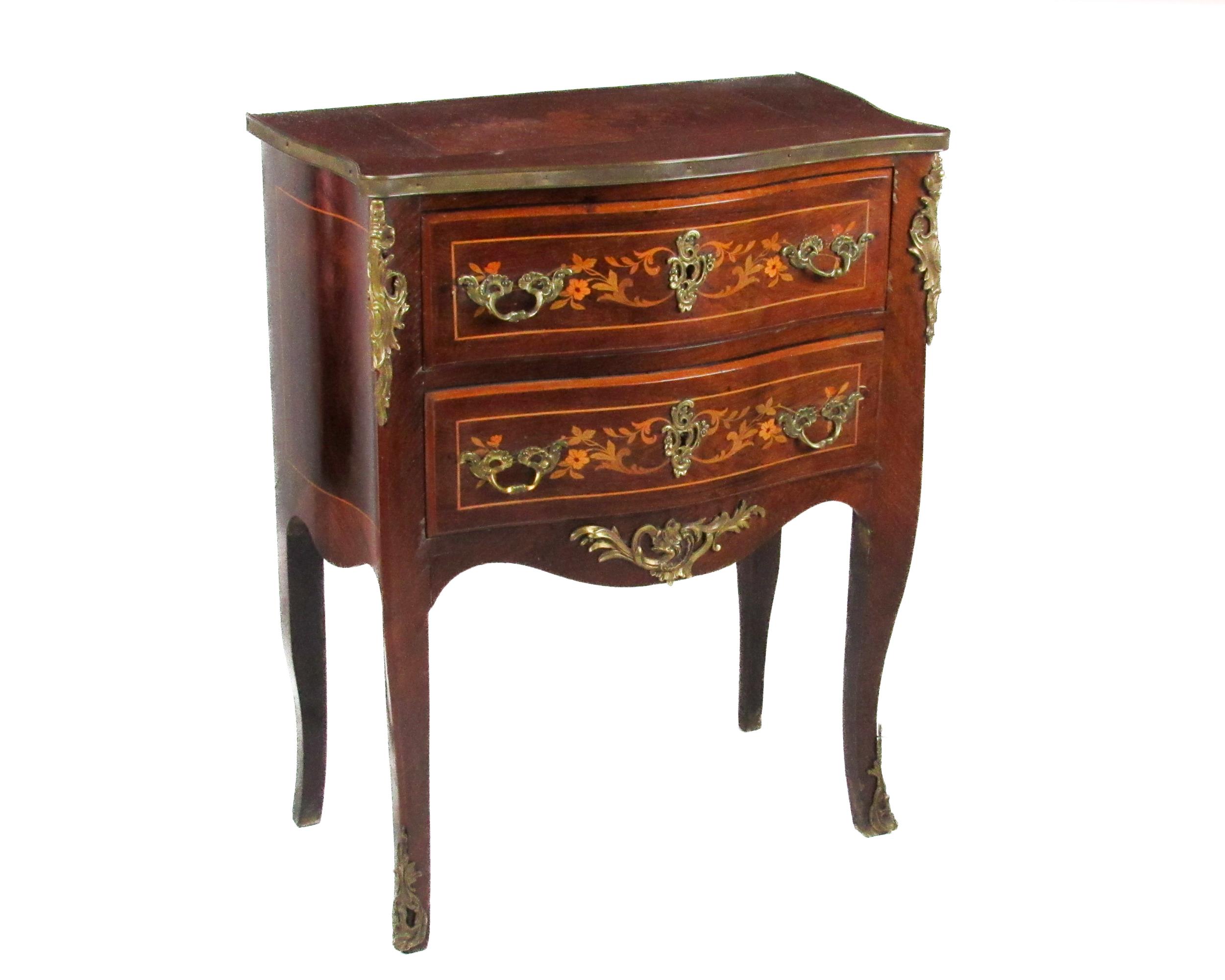 A French Louis XVI style bombe shaped Commode, of small proportions with floral marquetry top