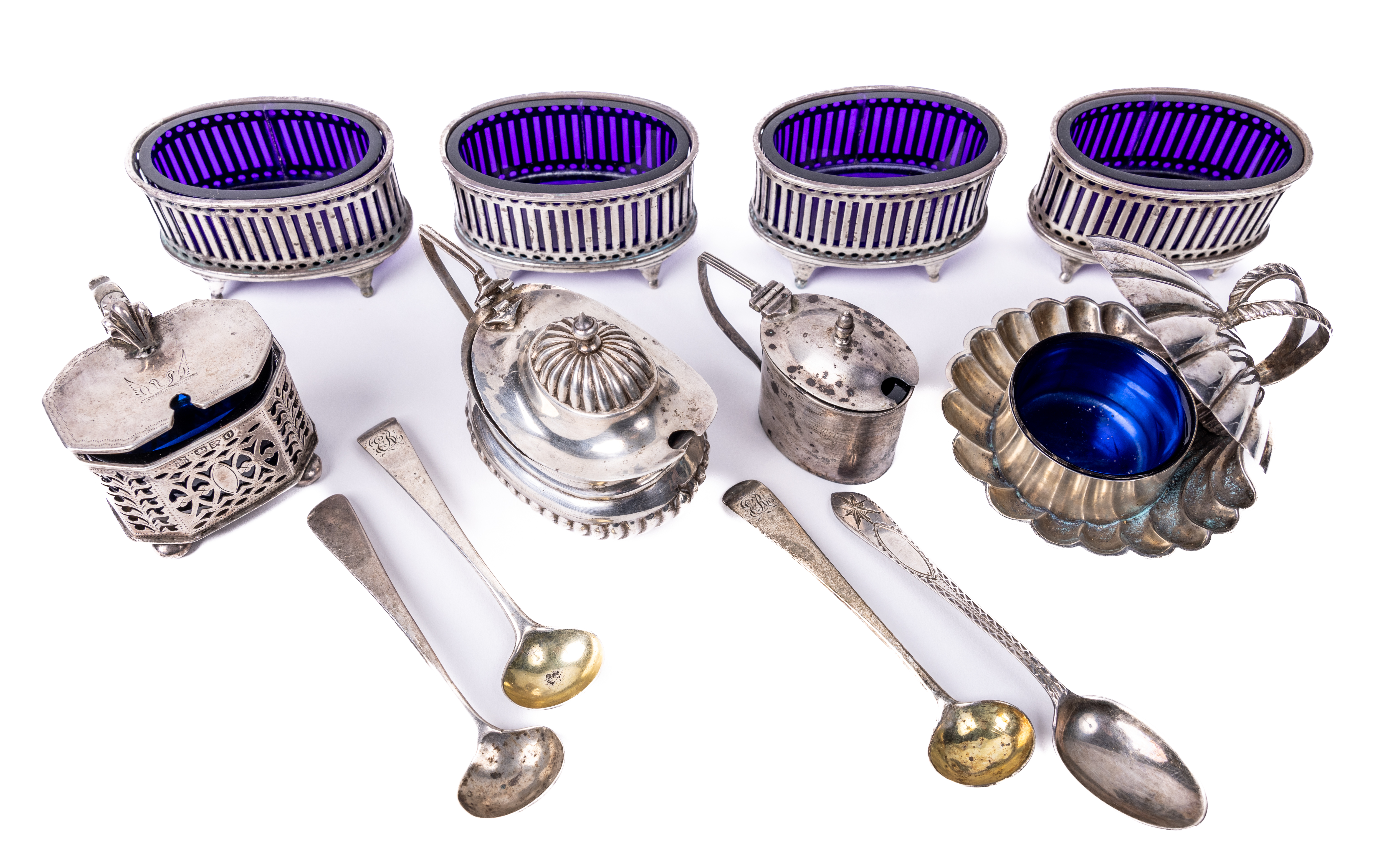 A set of four English silver oval Salts, Georgian style with blue glass liners, by S.L. Ltd., (