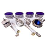 A set of four English silver oval Salts, Georgian style with blue glass liners, by S.L. Ltd., (