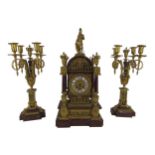 A fine quality 19th Century French Clock Garniture, the Clock with ormolu solider surmounted on a