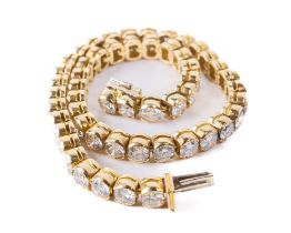 An attractive 18ct yellow gold Tennis Bracelet, (14.8gms) set with 52 diamonds (6.76tcs) GVS2,