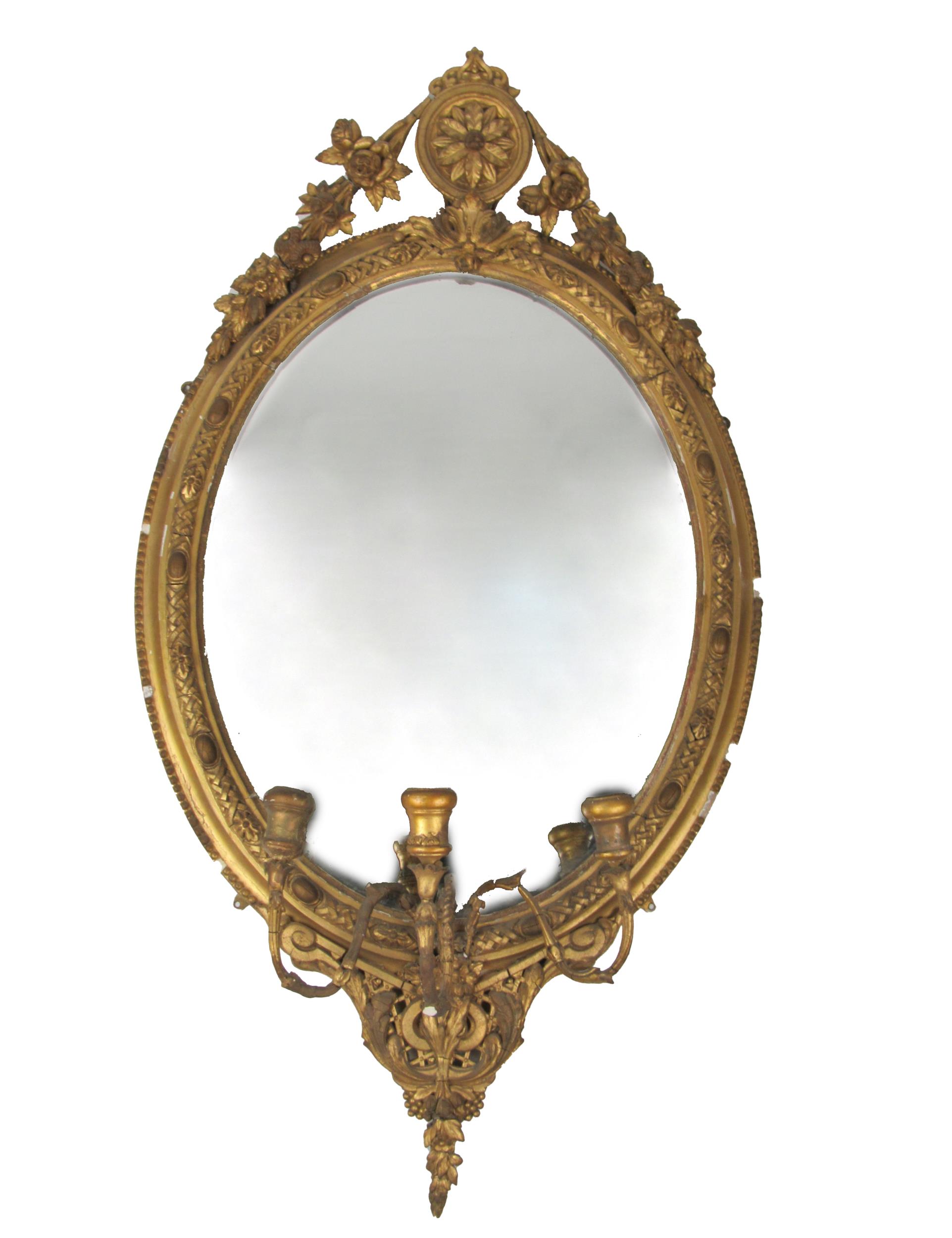 A Victorian giltwood Girandole, the oval frame with ornate cartouche and decorative border, with