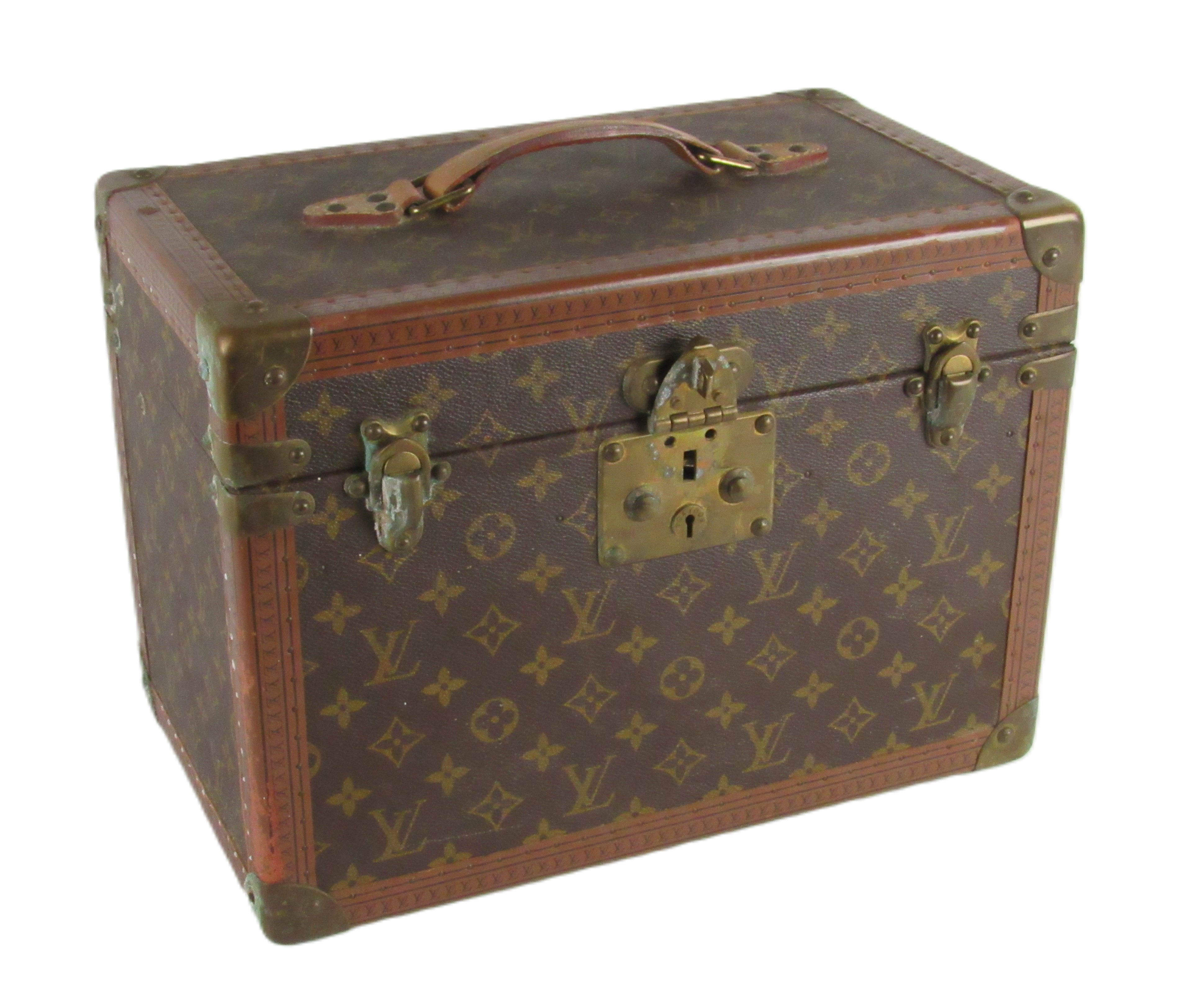 An original Louis Vuitton leather Vanity Case, with hinged top, carrying handle, opening to reveal