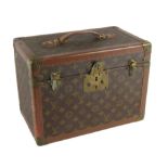 An original Louis Vuitton leather Vanity Case, with hinged top, carrying handle, opening to reveal