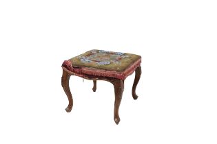 A Victorian walnut framed Footstool, with beadwork padded seat on carved cabriole legs. (1)