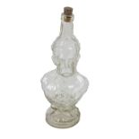 Advertisement: A moulded figural glass Bottle, of Lord Kitchener, approx. 32cms (12 1/2") high. (1)