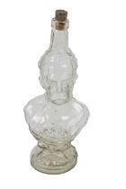 Advertisement: A moulded figural glass Bottle, of Lord Kitchener, approx. 32cms (12 1/2") high. (1)