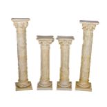 A pair of assimilated marble Columns, with square tops over Corinthian capitals and ornate