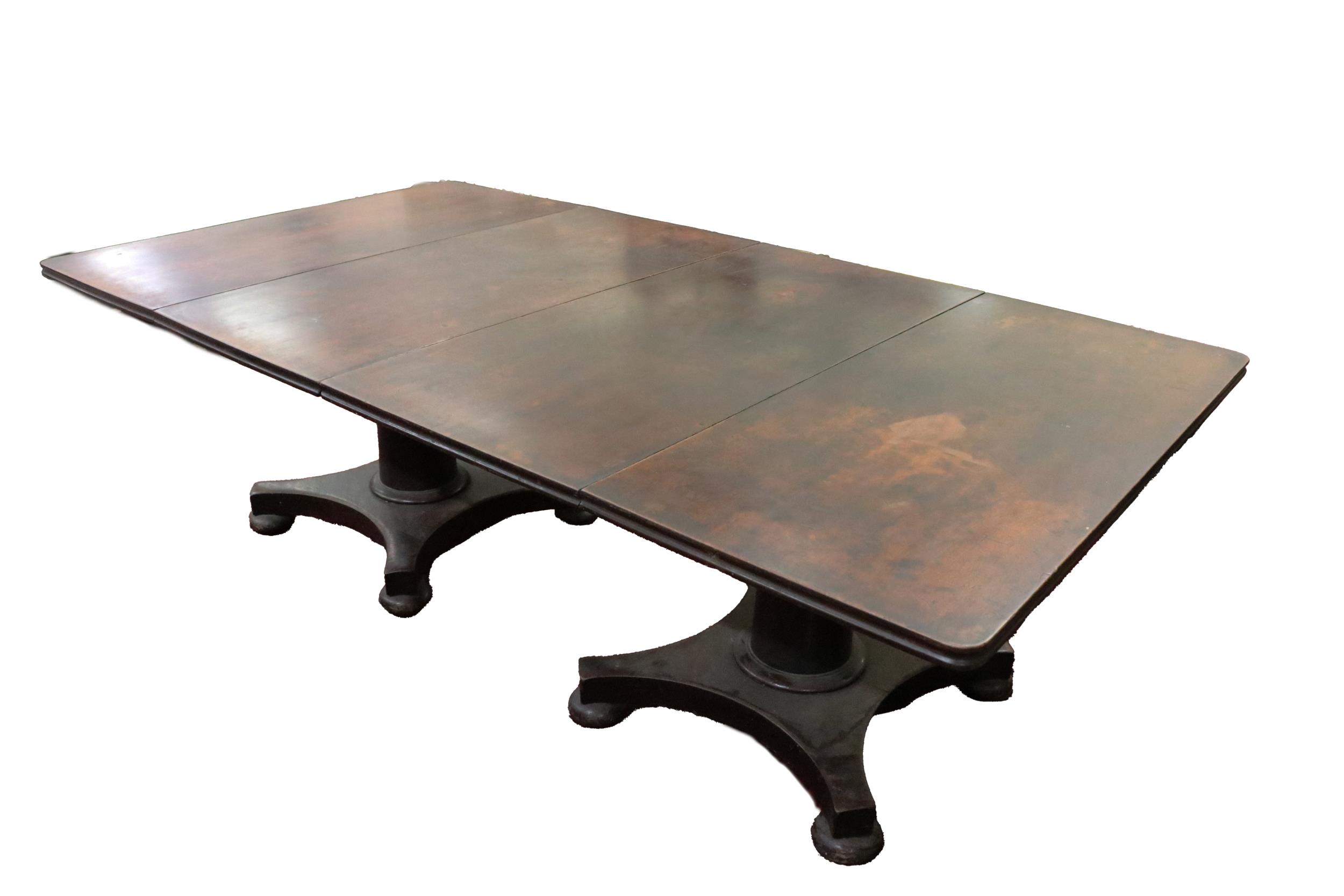 An Irish William IV period mahogany two pod Dining Table, the plain top with moulded edge, on pillar