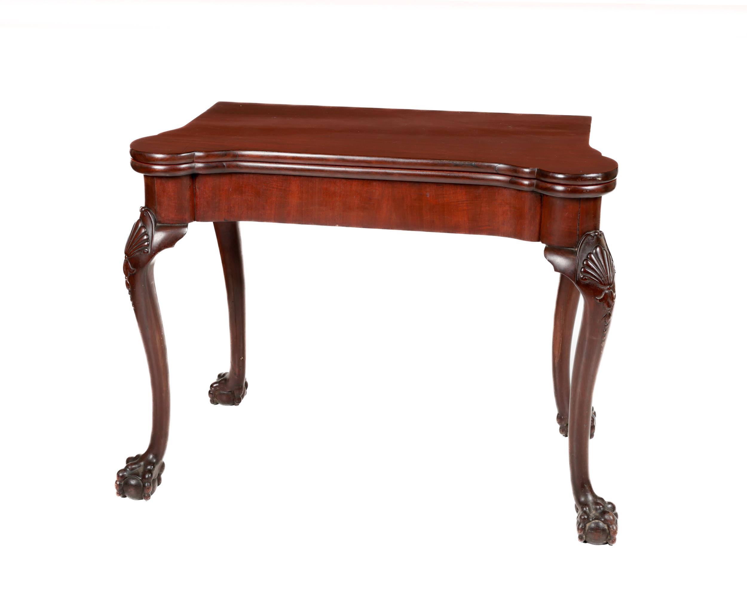 An attractive 19th Century Irish mahogany fold-over Card Table, with projecting four rounded corners