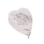 An attractive love heart shaped silver Jewellery Casket, the hinged top with embossed decorative