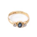 An attractive Ladies 9ct gold Ring, set with central oval sapphire, flanked by two small diamonds,