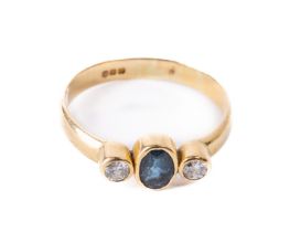 An attractive Ladies 9ct gold Ring, set with central oval sapphire, flanked by two small diamonds,