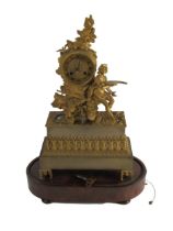 An attractive 19th Century French ormolu figural Mantle Clock, the top with assimilated cliff with