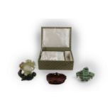 An attractive carved Chinese jade Model, the celadon top with central pierced medallion surrounded