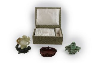 An attractive carved Chinese jade Model, the celadon top with central pierced medallion surrounded