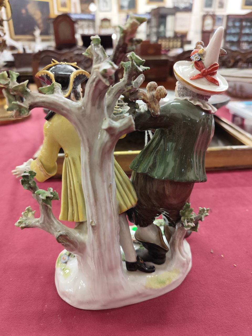 A large Meissen Group, with gentleman in bright yellow coat, and a Jester in green coat, offering - Image 3 of 5