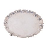 An attractive Georgian style circular three legged Salver or Waiter, the moulded and shaped rim with