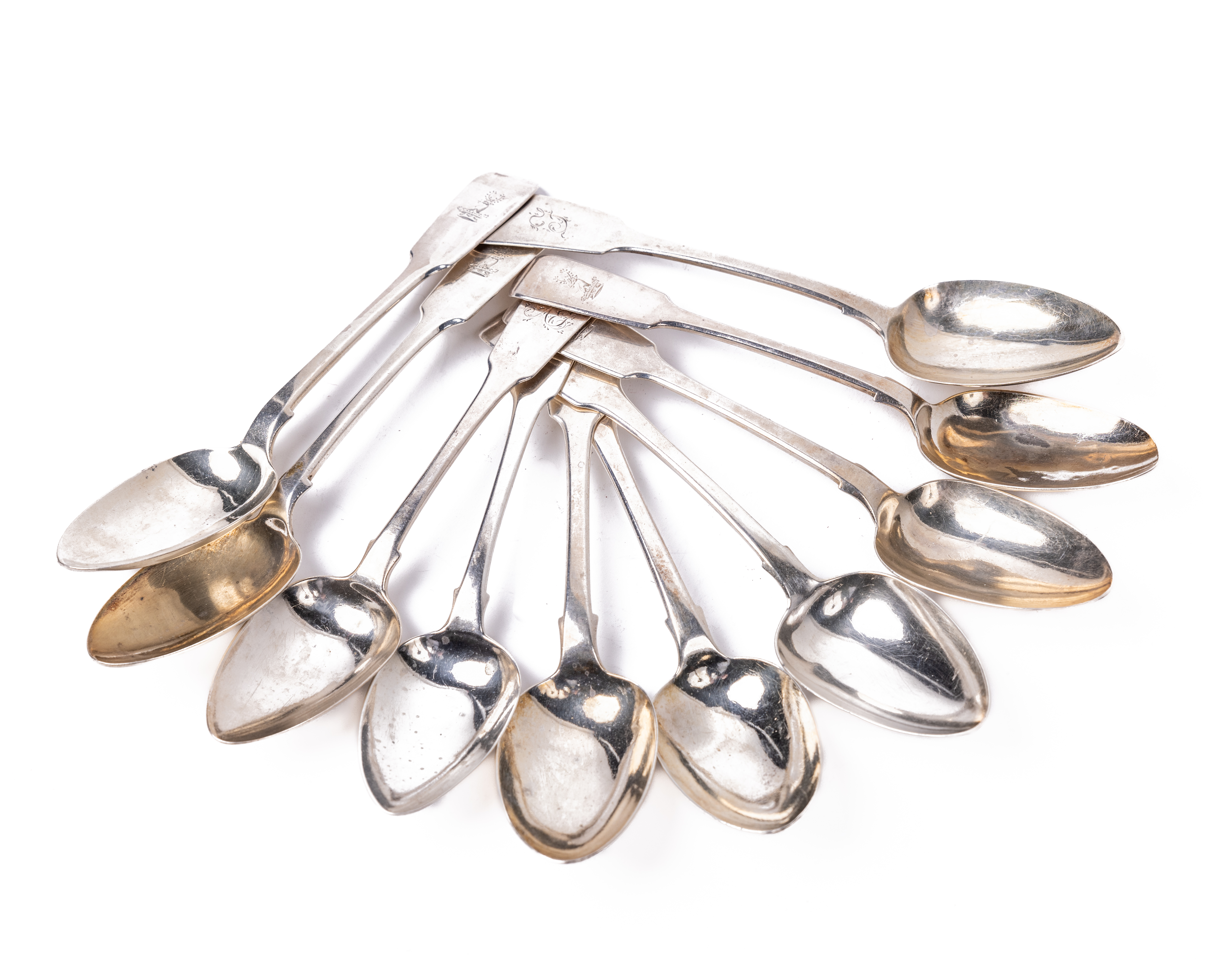 A set of 10 varied Irish silver fiddle pattern and rat-tail design Dessert Spoons (6 + 2 + 2),