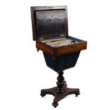 A Victorian rosewood Ladies Work Table, lift top with sunken container on a turned pillar support on
