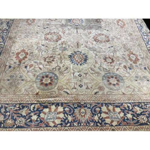 A fine quality Middle Eastern Carpet, the central panel with cream ground and bouquet of flowers