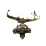 An attractive and ornate brass Model, of a Gondola and Gondolier, embellished with floral garlands
