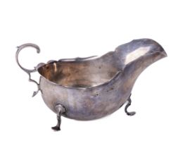 A plain English silver Sauceboat, with "C" scroll handle on trifid feet, approx. 6.5 ounces by