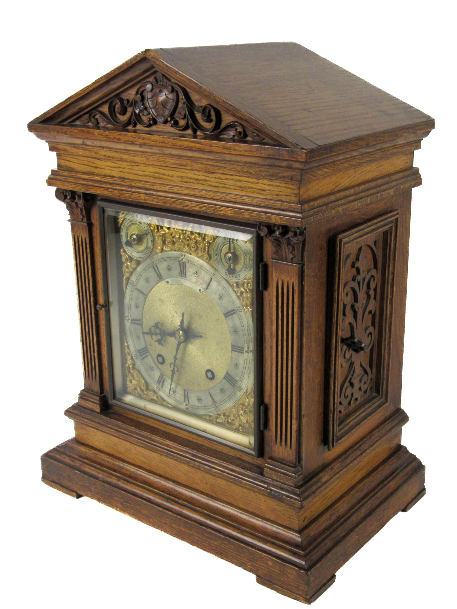 An oak cased 20th Century German made brass and steel dial Bracket Clock, the arched hood over