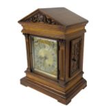 An oak cased 20th Century German made brass and steel dial Bracket Clock, the arched hood over