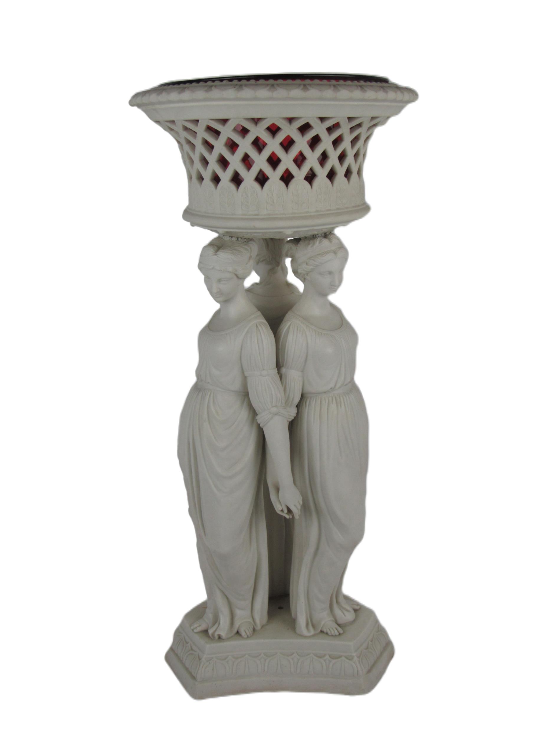 A large Copeland Parian ware figural Jardiniere, with pierced basket top and ruby glass liner