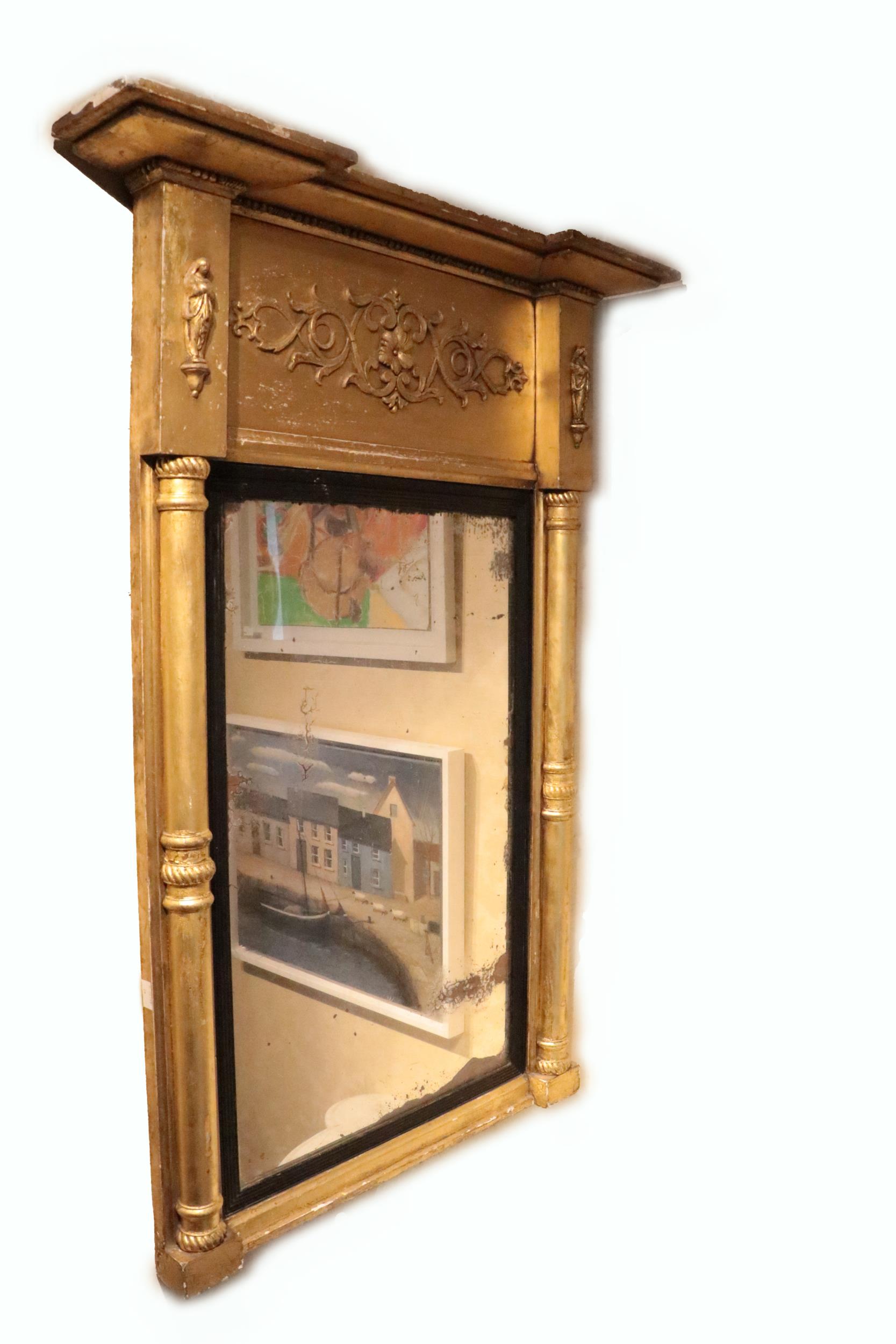 An attractive gilt pier Mirror, 19th Century, with inverted breakfront pediment above a relief
