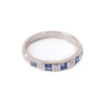 A Ladies 18ct white gold Ring Set, with princess cut sapphire and diamonds, four diamonds (.06ct)