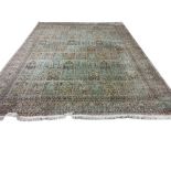 A magnificent pair of 20th Century silk Middle Eastern Carpets, the cream and rust ground with