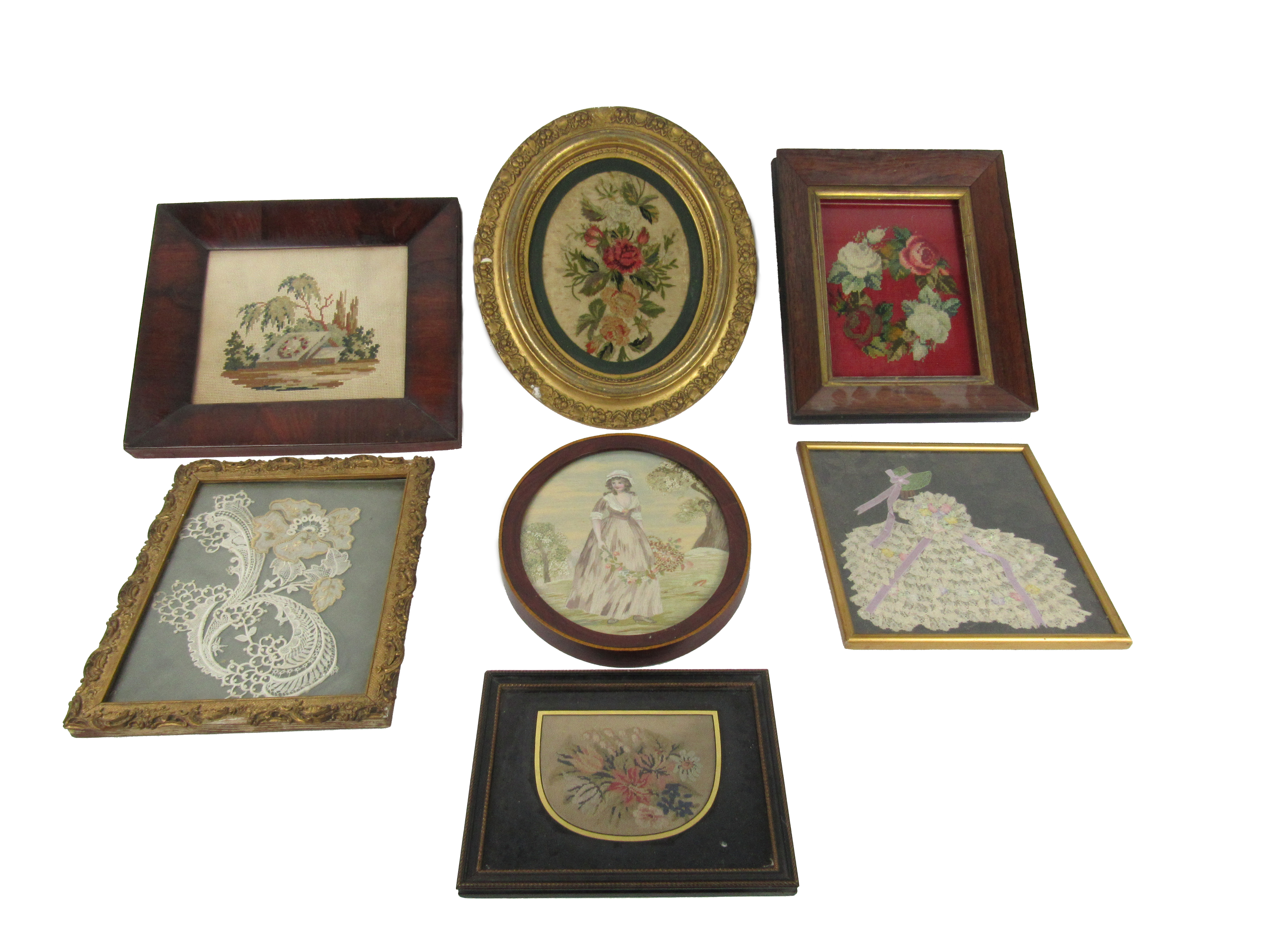 A large collection of small framed embroidered tapestry Samples, mostly floral subjects, framed. (7)