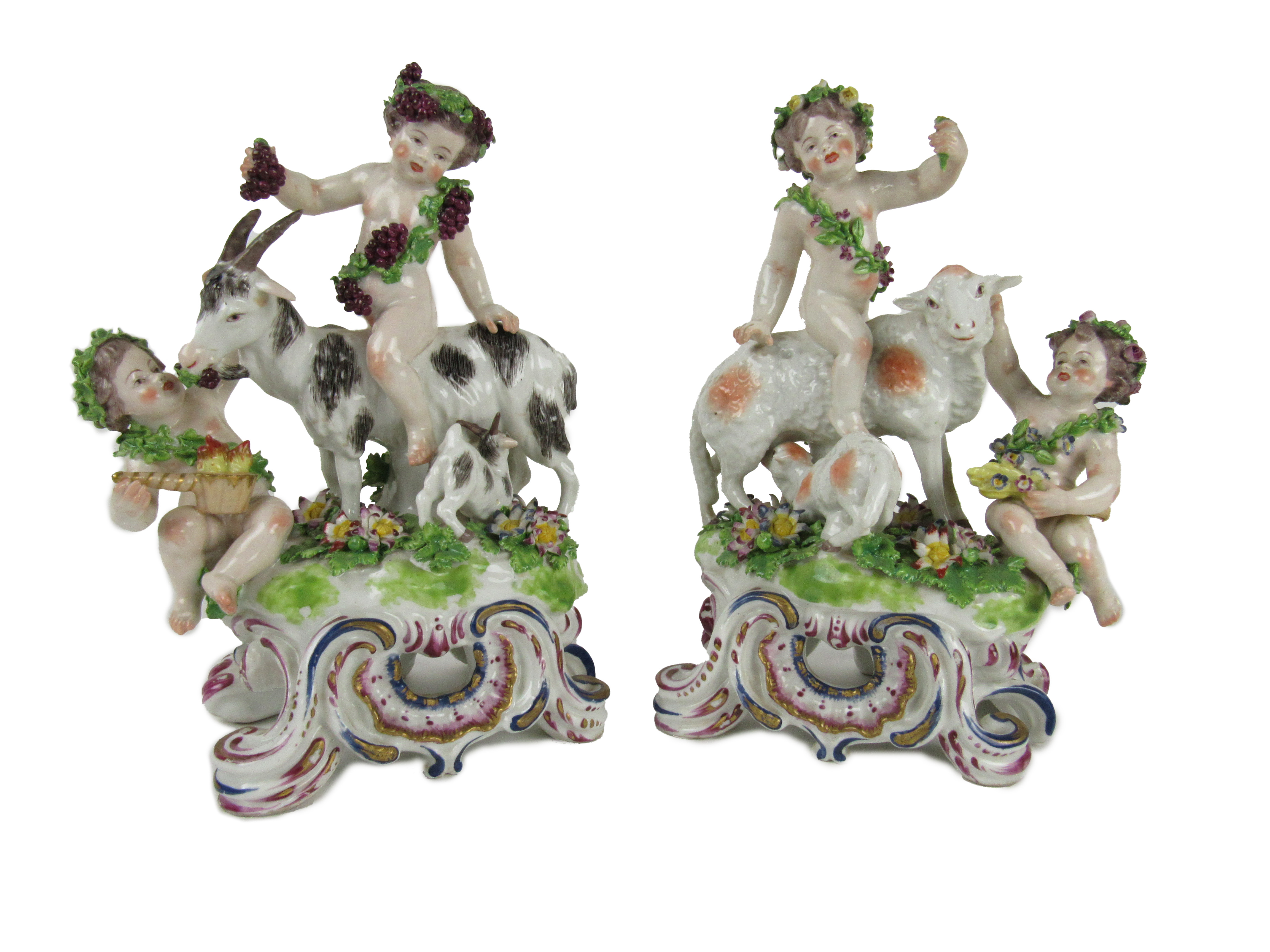 A very good pair of mid-18th Century bow porcelain Goat Groups, with kids and garlanded cupids,