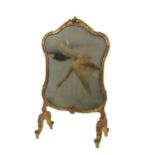 A 19th Century giltwood cartouche shaped Firescreen, with 'S' scroll and floral border, silk