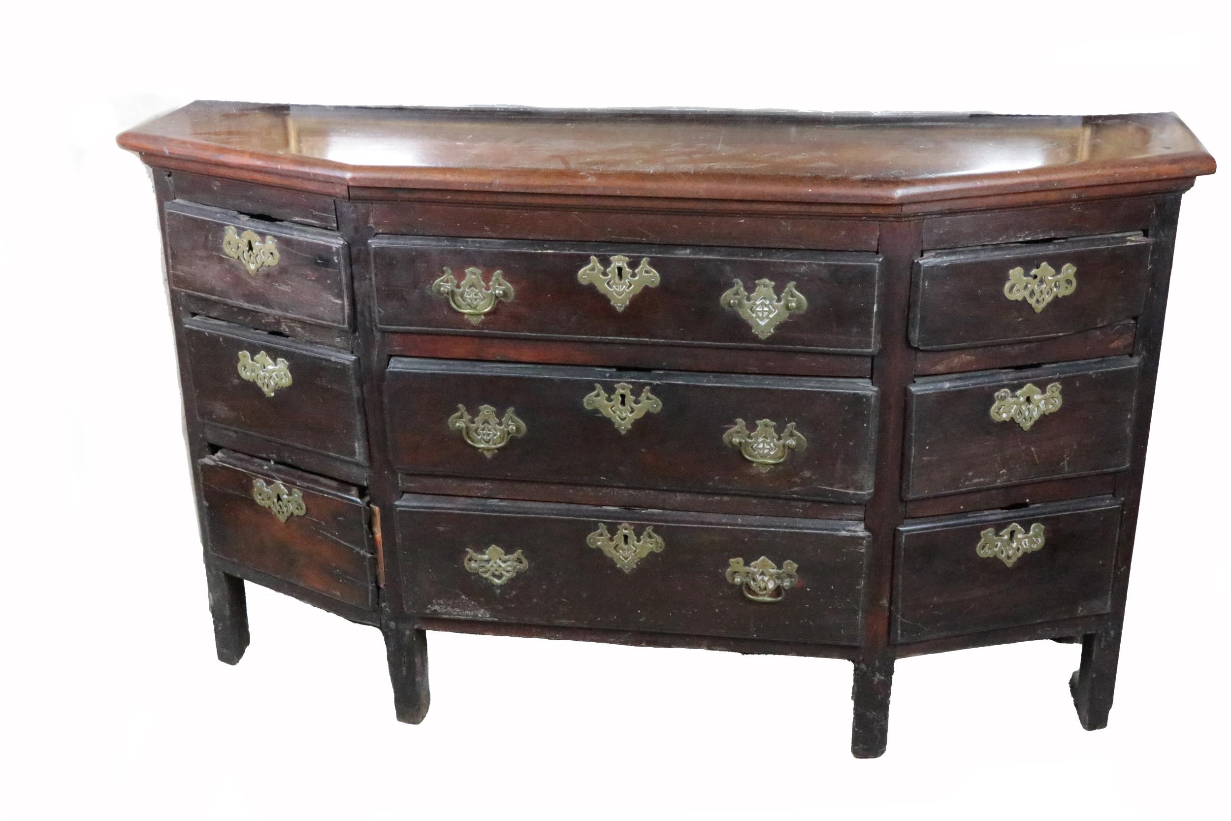 An unusual and early 19th Century Irish Provincial Chest, of angled form with three long central