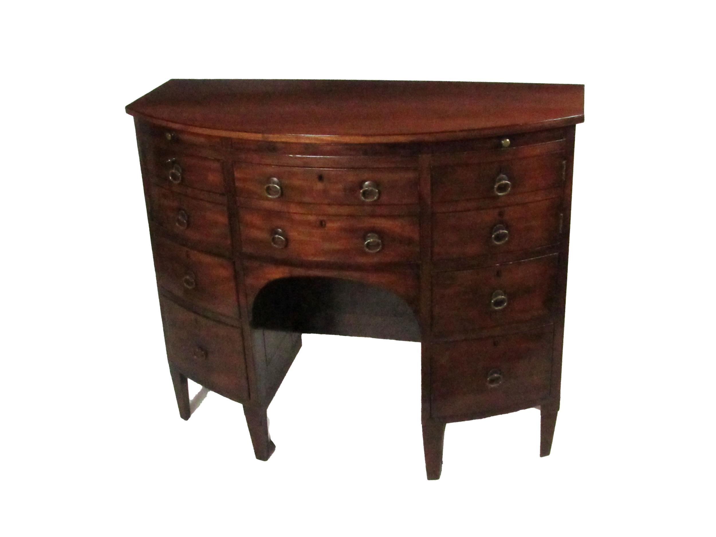 An unusual Georgian period Irish mahogany bow fronted Cabinet, possibly Cork, of narrow proportions,