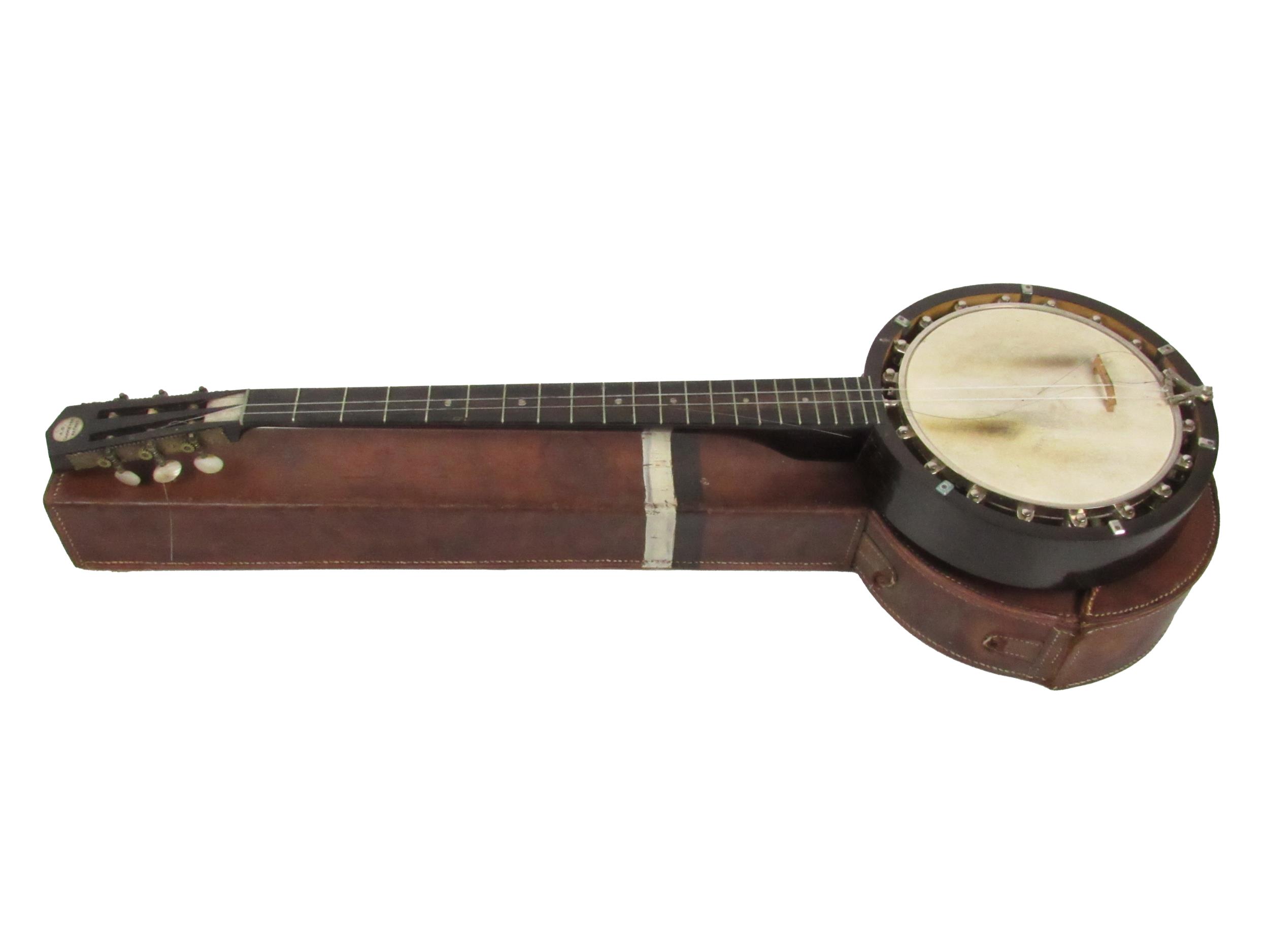 A late 19th Century Banjo, by A.D. Cammeyer (with label), inset mother-o-pearl turners, mahogany