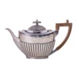 An attractive Georgian style medium sized Teapot, the hinged domed top with ebonised finial, and