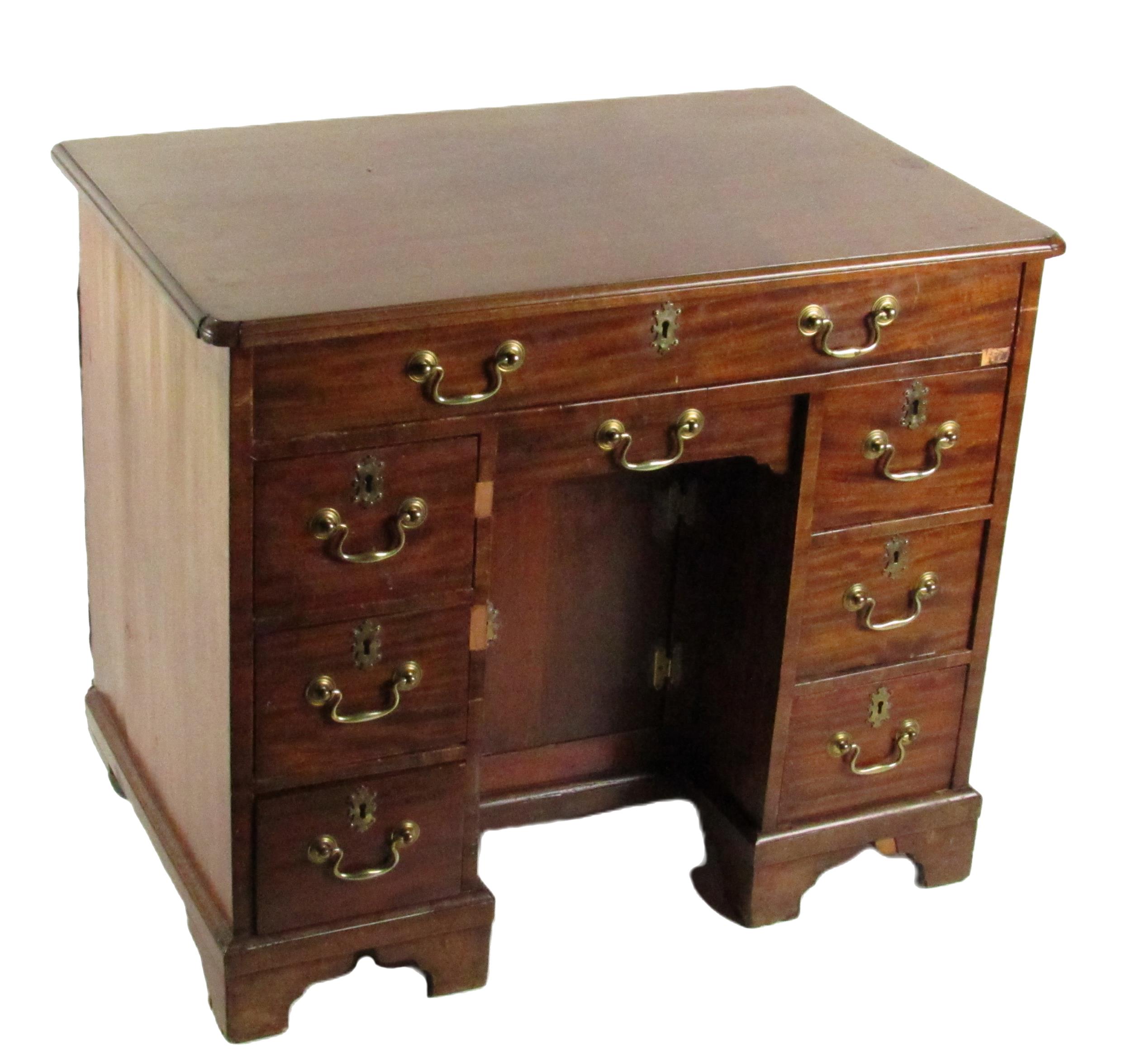 A Georgian period mahogany Gentleman's kneehole Desk, of rectangular shaped moulded top above a long