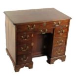 A Georgian period mahogany Gentleman's kneehole Desk, of rectangular shaped moulded top above a long