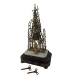 A Victorian brass 'Sir Walter Scott' Memorial Skeleton Clock, with central spire, crochets and an