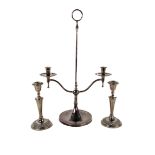 An attractive two branch silver plated Candlestick, with elongated carrying handle on circular base,