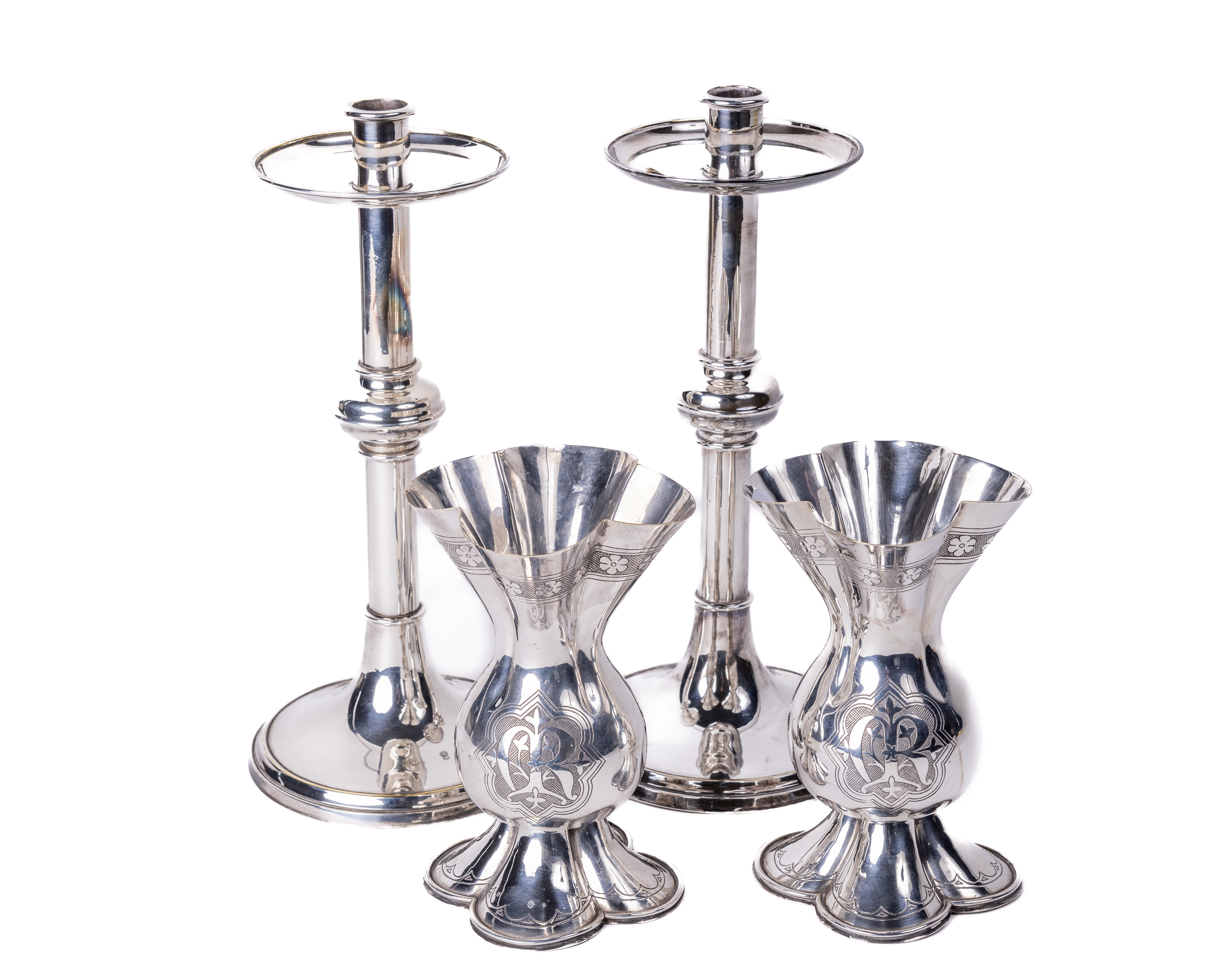 A pair of fine quality silver plated Arts and Crafts pillar Candlesticks, with circular drop tray on